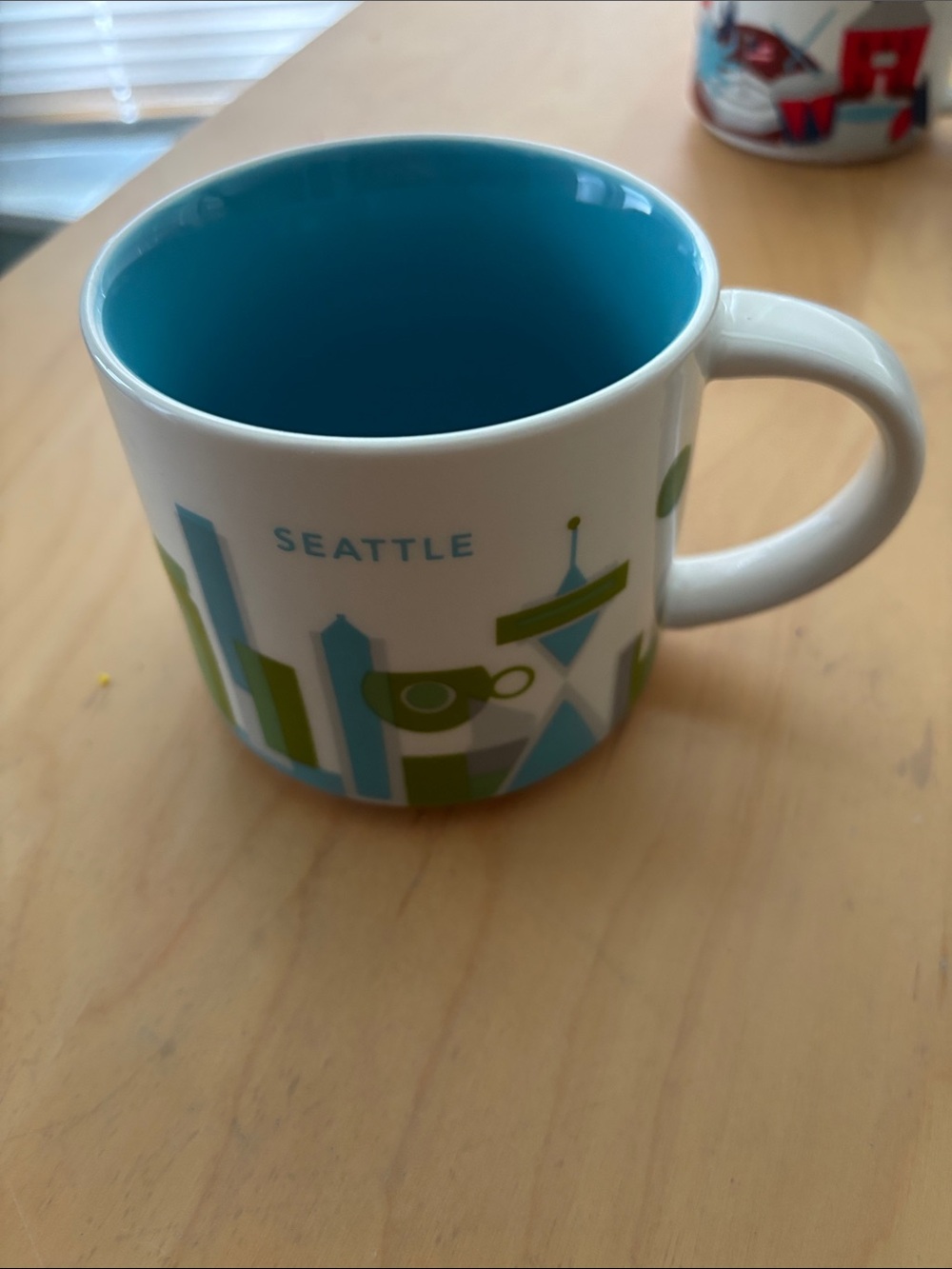Starbucks Seattle Skyline White Mug with Blue Interior and Green Accents
